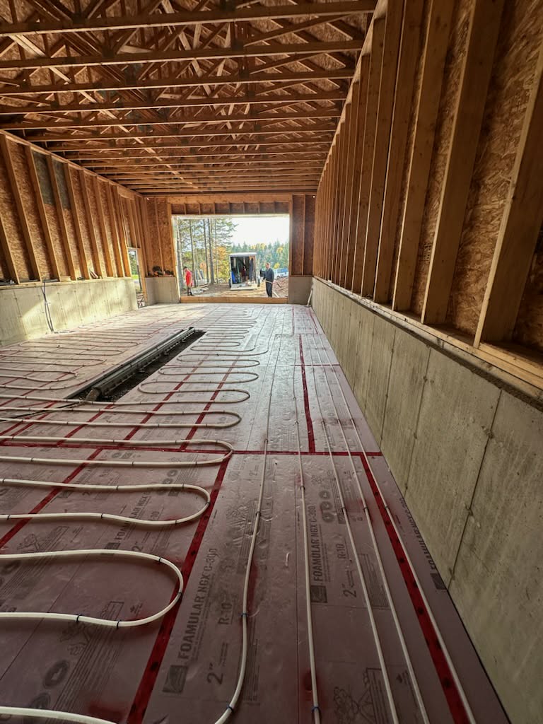 Radiant floor heating lines installed throughout a new construction project