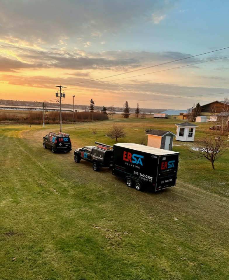 ERSA Plumbing service trucks and trailer in Cocagne, New Brunswick