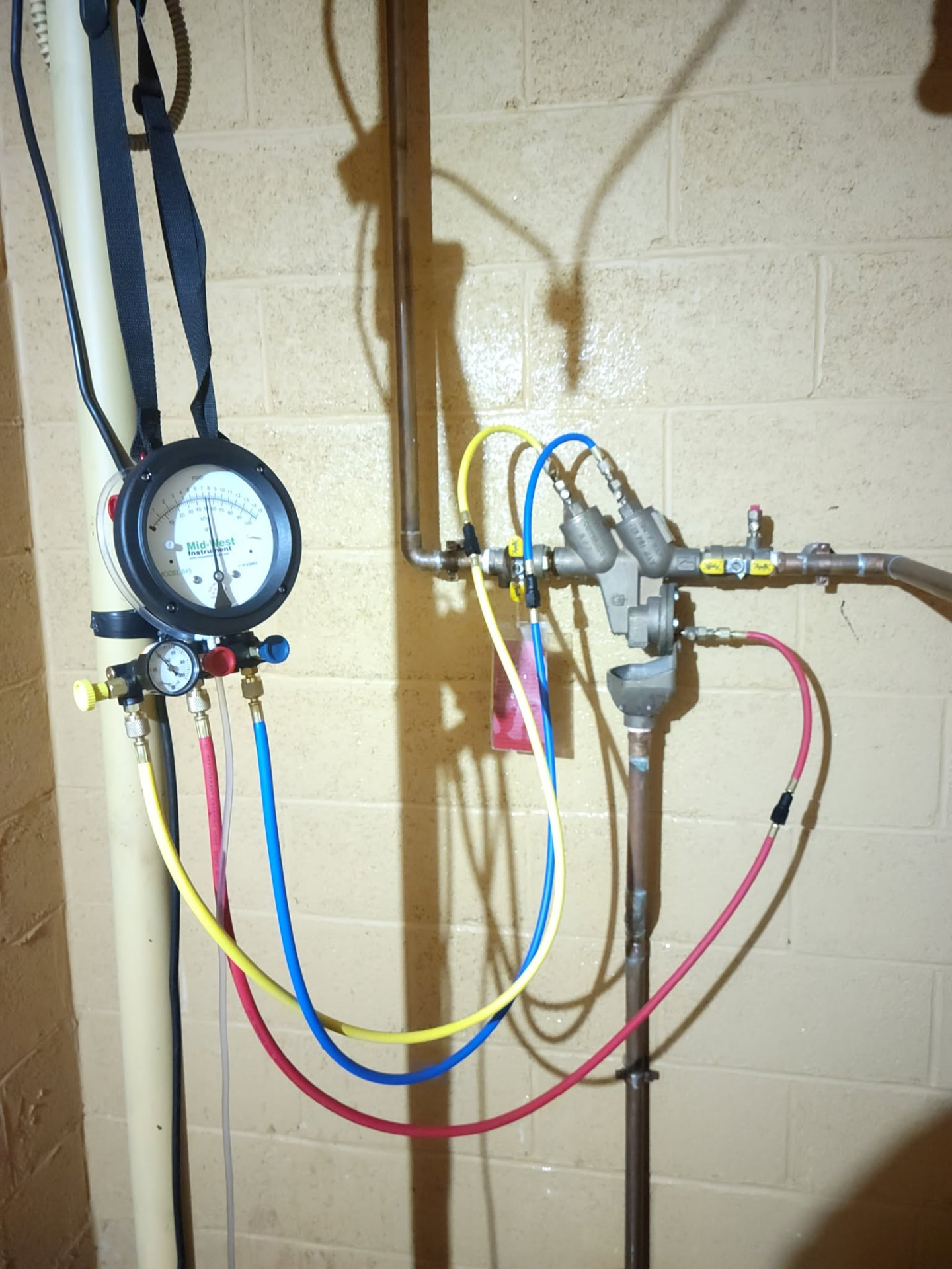 Backflow preventer test kit connected to a commercial backflow preventer valve assembly