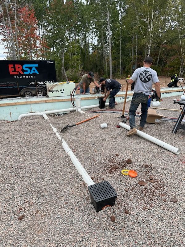 ERSA Plumbing crew installing drain lines on a new build slab