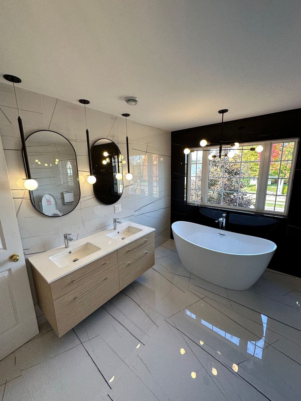 Finished modern bathroom with freestanding tub installed by ERSA Plumbing