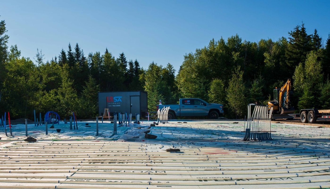 ERSA Plumbing crew installing underground and under-slab plumbing on a new construction site