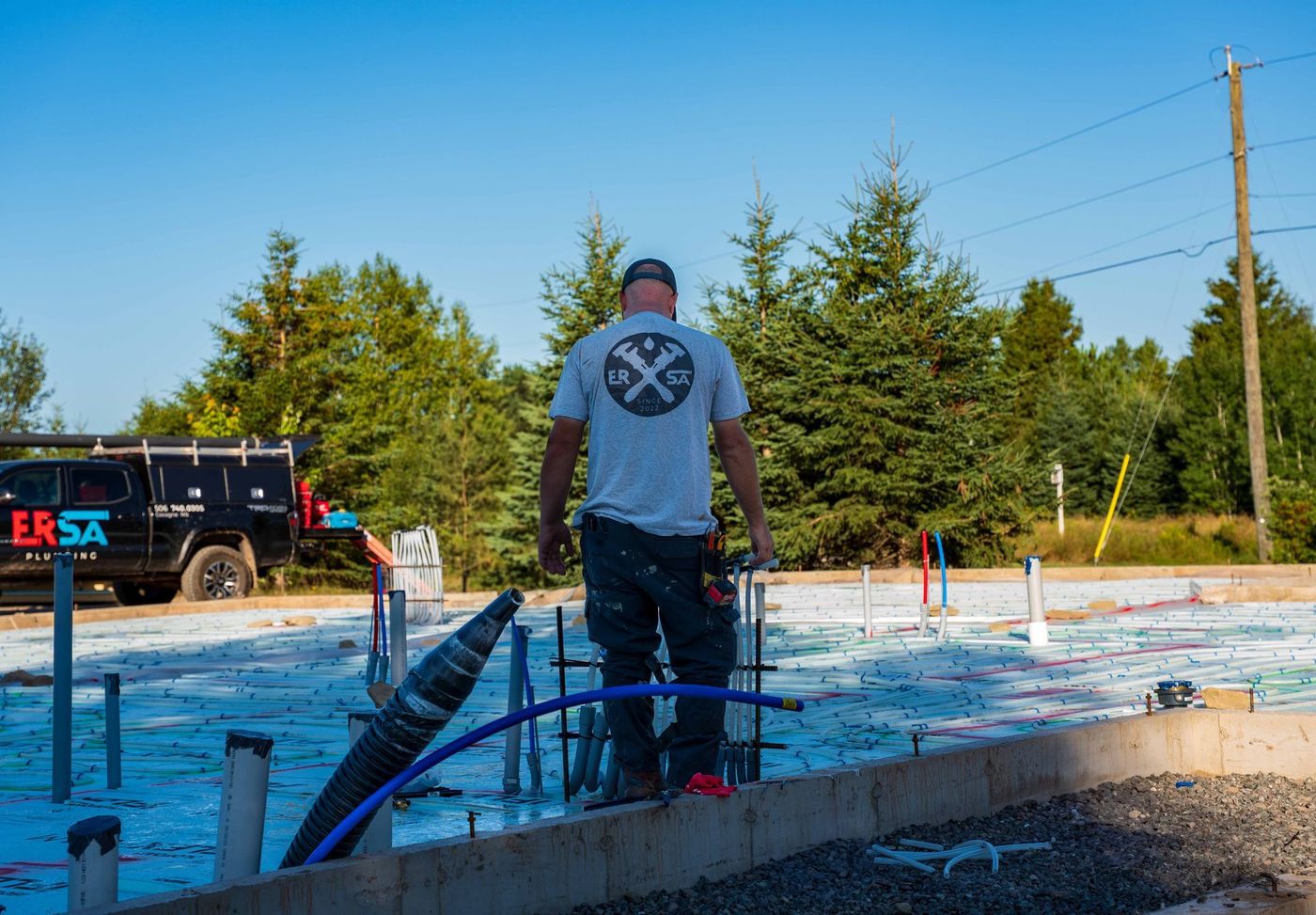 ERSA Plumbing crew installing underground and under-slab plumbing on a new construction site