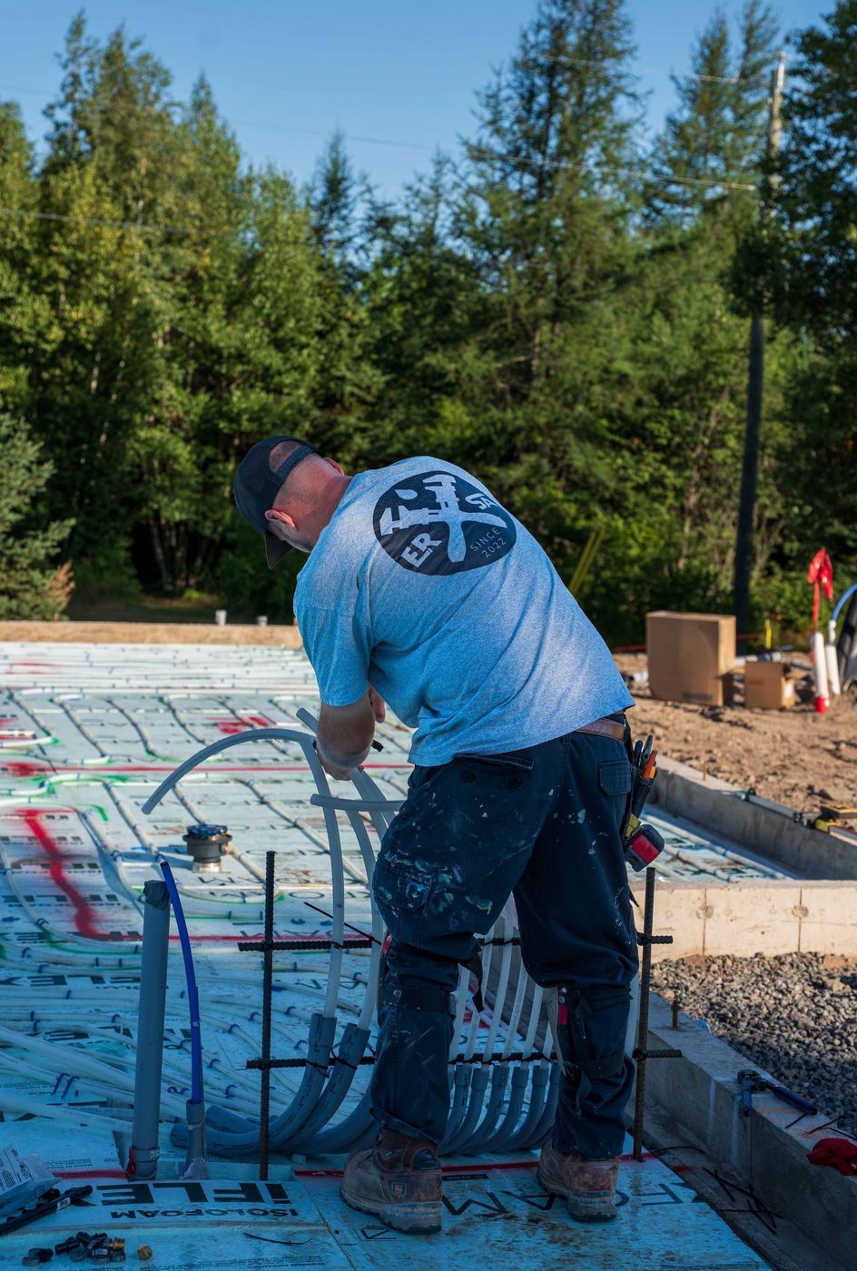 ERSA Plumbing crew installing underground and under-slab plumbing on a new construction site