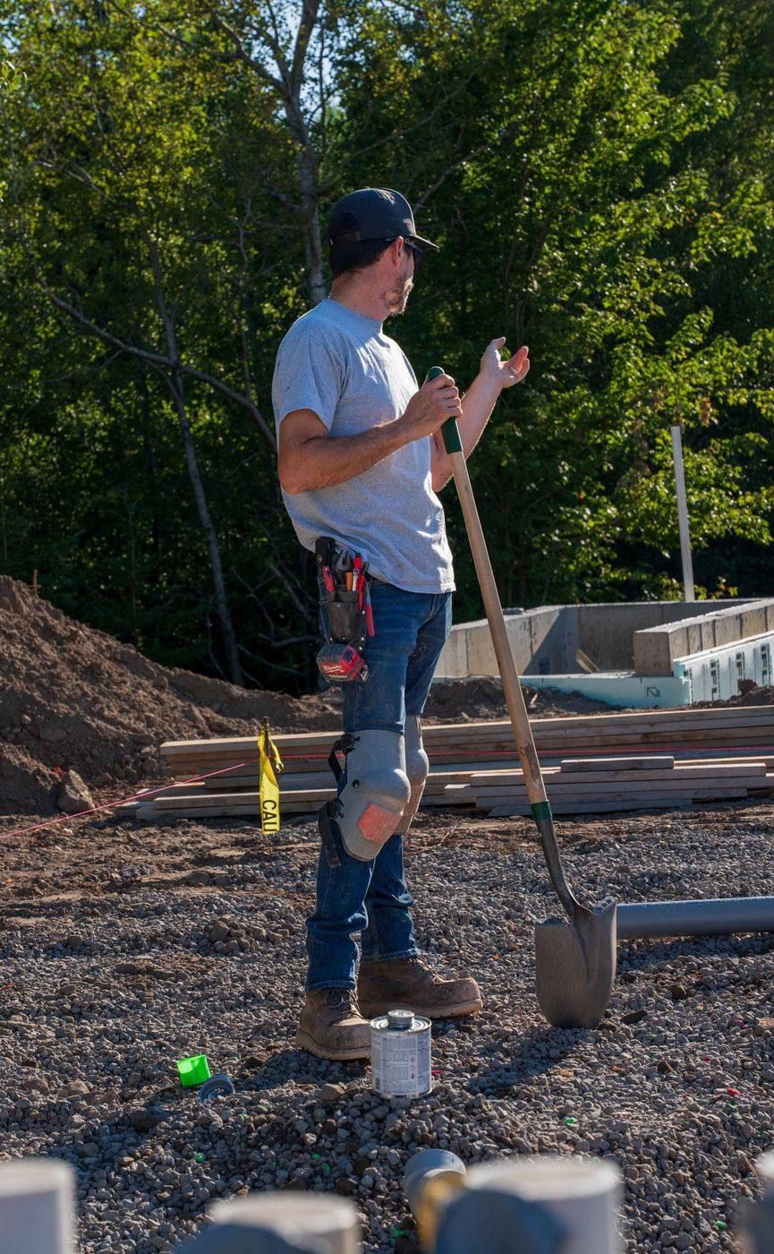 ERSA Plumbing crew installing underground and under-slab plumbing on a new construction site