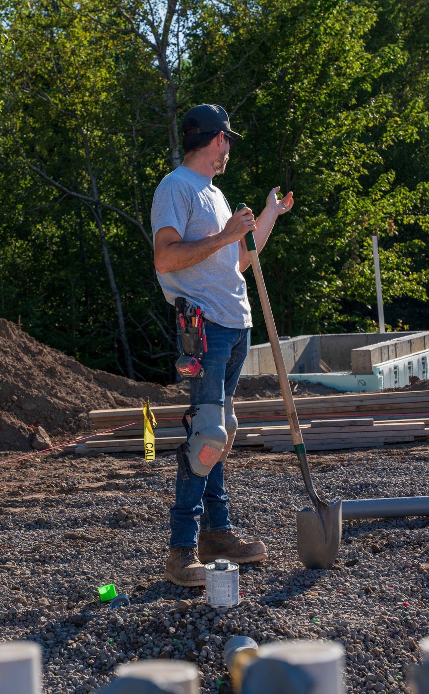 ERSA Plumbing crew installing underground and under-slab plumbing on a new construction site