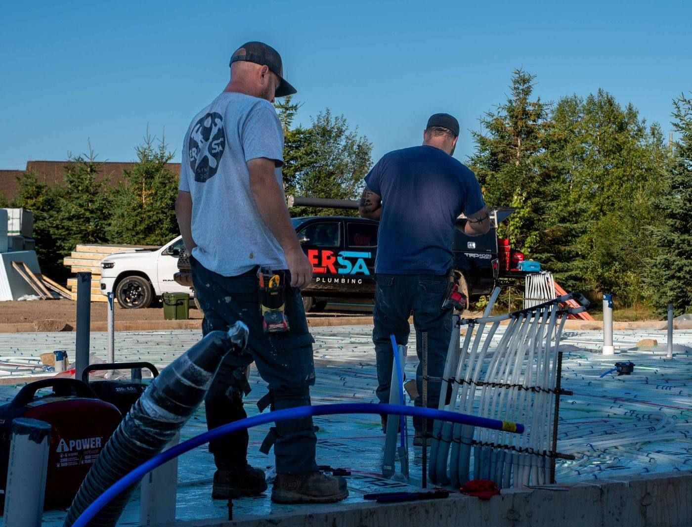ERSA Plumbing crew installing underground and under-slab plumbing on a new construction site