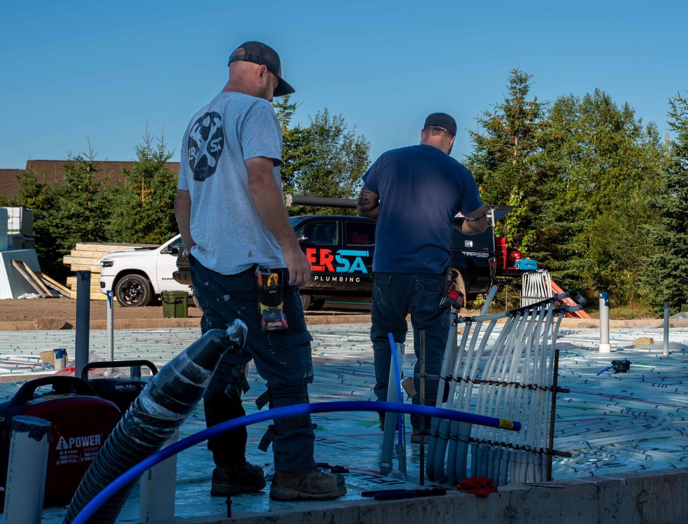 ERSA Plumbing crew installing underground and under-slab plumbing on a new construction site