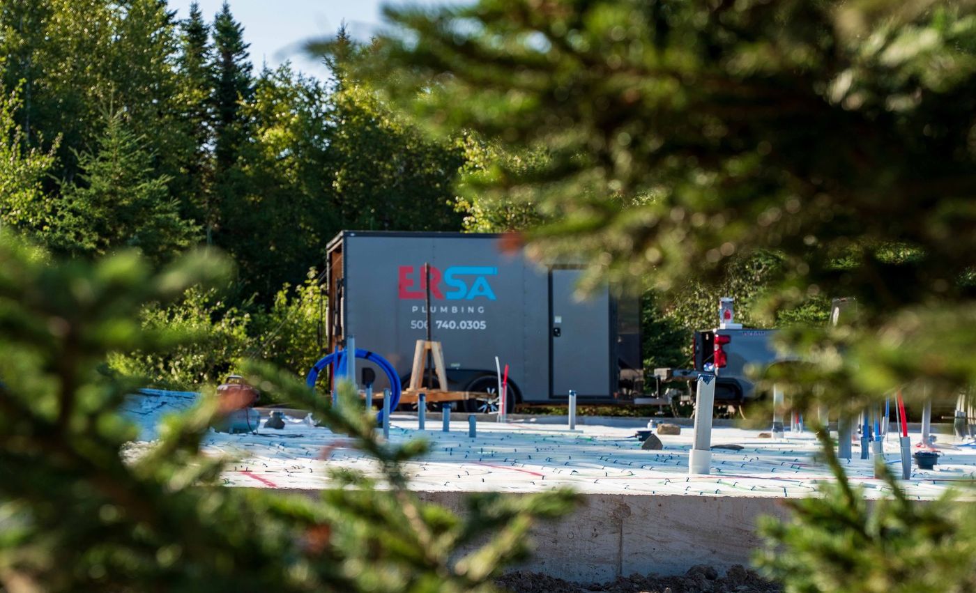 ERSA Plumbing crew installing underground and under-slab plumbing on a new construction site