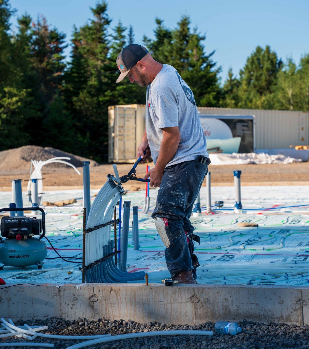 ERSA Plumbing crew installing underground and under-slab plumbing on a new construction site