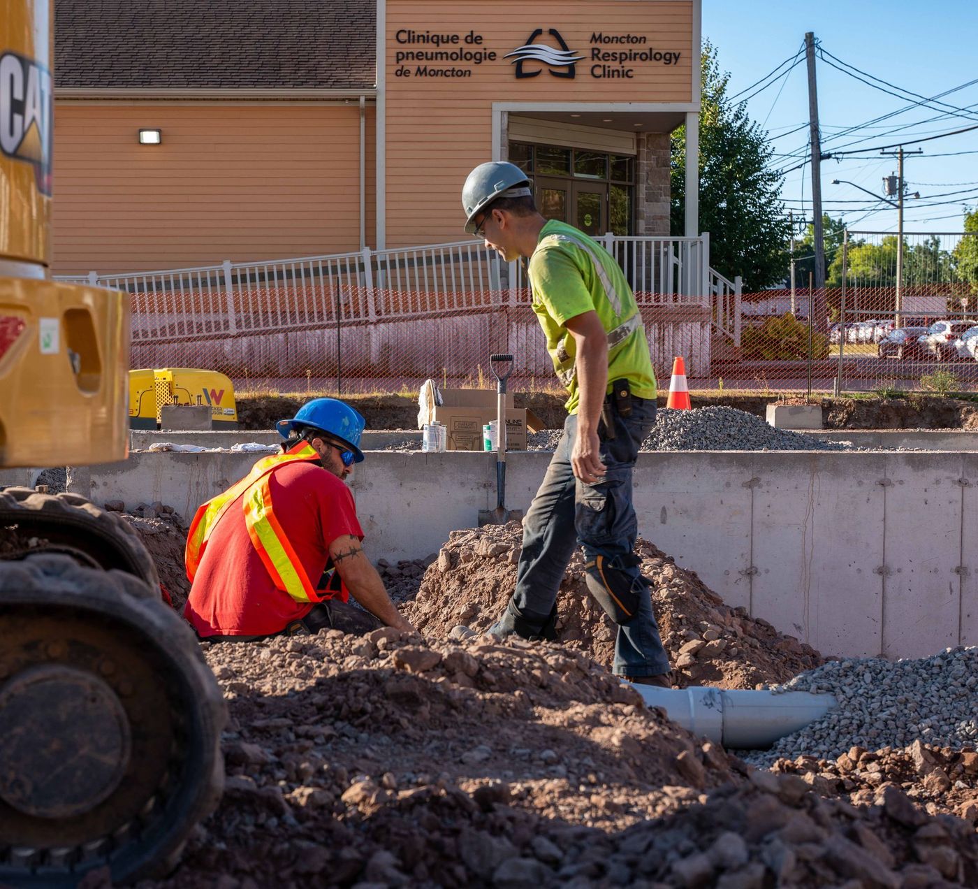 ERSA Plumbing crew running water and sewer service lines on a commercial construction project