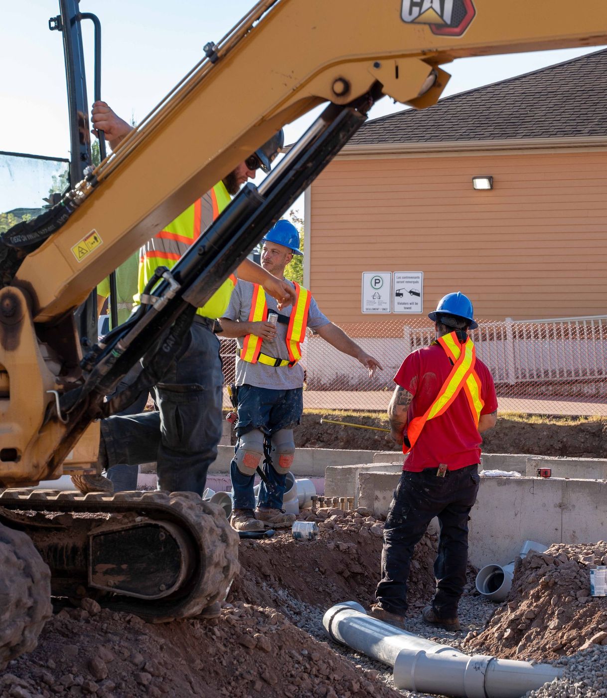 ERSA Plumbing crew running water and sewer service lines on a commercial construction project