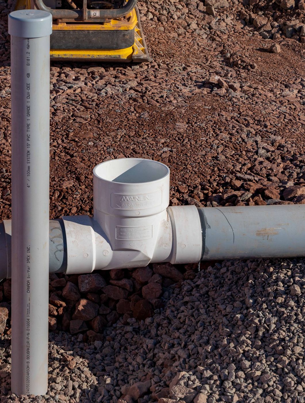 ERSA Plumbing crew running water and sewer service lines on a commercial construction project