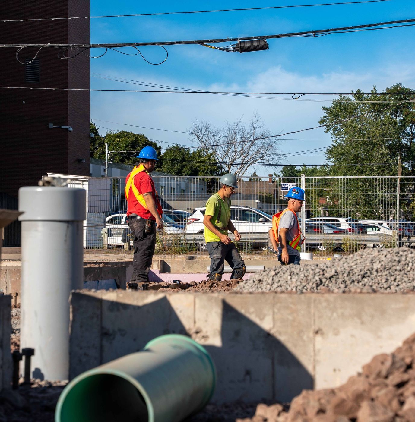 ERSA Plumbing crew running water and sewer service lines on a commercial construction project